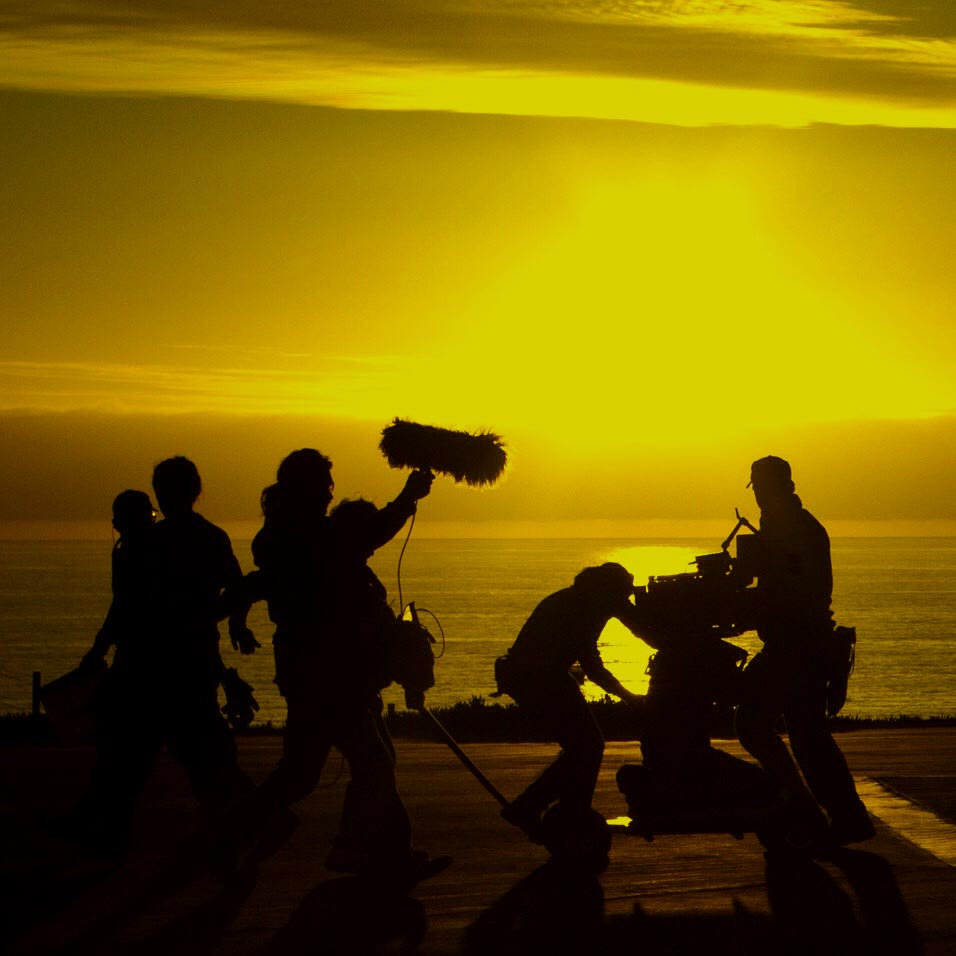 film crew near the beach